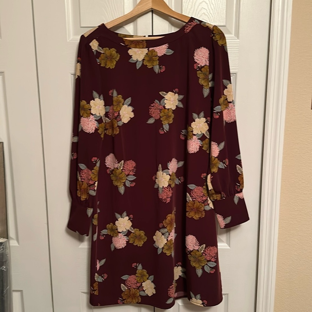 This beautiful long sleeve dress can easily be paired with boots or heels!